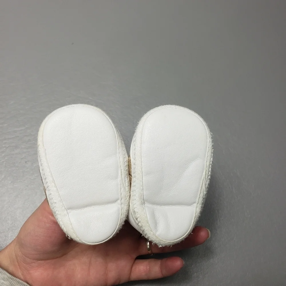 unbranded newborn white and brown gender neutral monkey shoes/slippers